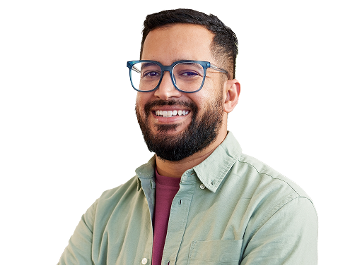 Man in his thirties with glasses smiling at camera